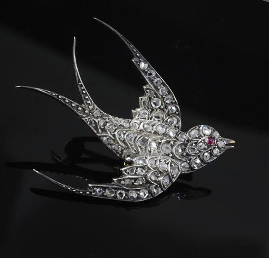 A late Victorian gold, silver and rose cut diamond set swallow brooch, length 47mm.